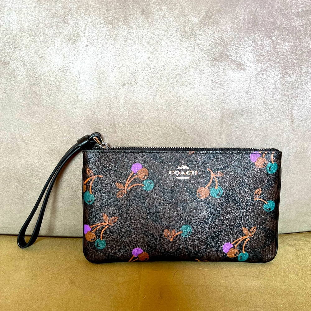 Brown Leather Coach Wristlet with Teal and Purple Cherry Detail